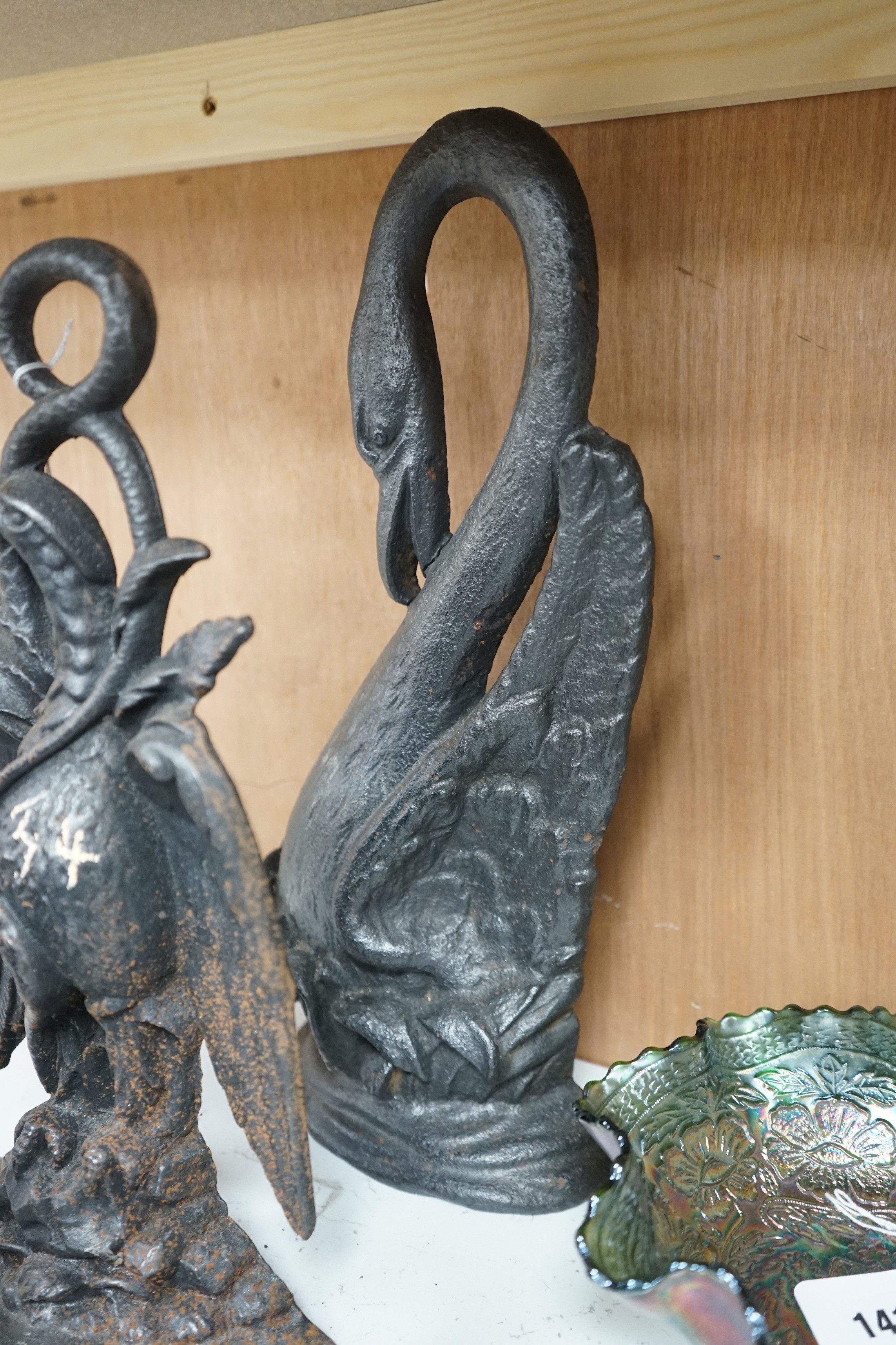 Five assorted cast iron bird designed doorstops, tallest swan 40cms high